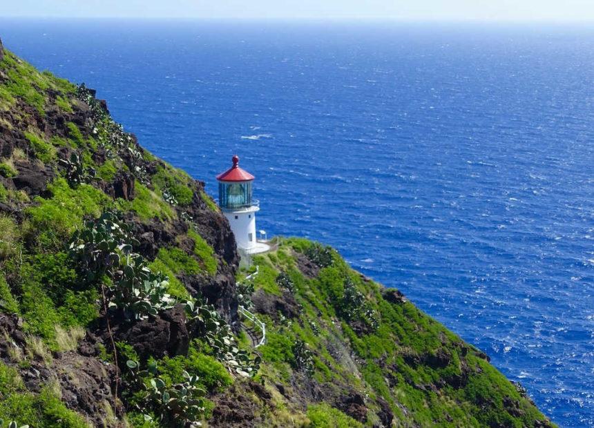 lighthouse on a green slope